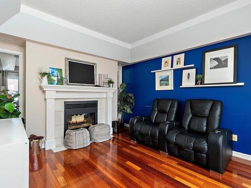 4340 28A Street, Edmonton, AB - Indoor Photo Showing Living Room With Fireplace