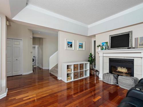 4340 28A Street, Edmonton, AB - Indoor Photo Showing Living Room With Fireplace