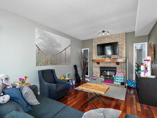 4340 28A Street, Edmonton, AB - Indoor Photo Showing Living Room With Fireplace