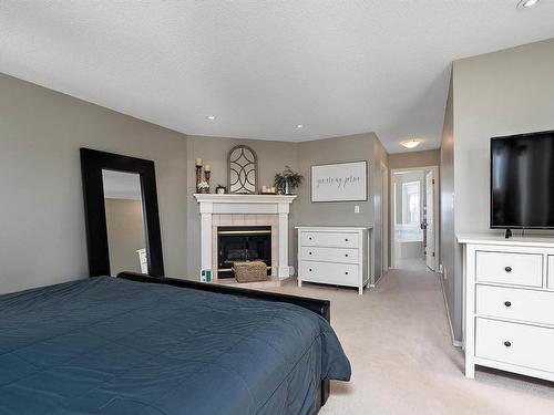 4340 28A Street, Edmonton, AB - Indoor Photo Showing Bedroom With Fireplace