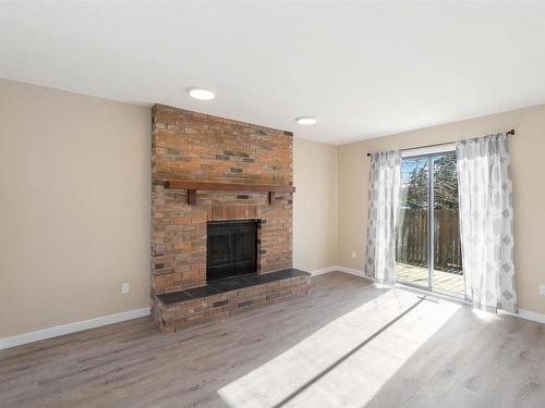 18003 76 Avenue, Edmonton, AB - Indoor Photo Showing Living Room With Fireplace