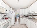 11 2911 36 Street, Edmonton, AB  - Indoor Photo Showing Kitchen With Double Sink 