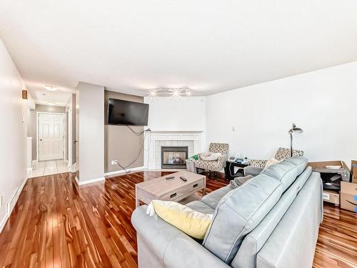 11 2911 36 Street, Edmonton, AB - Indoor Photo Showing Living Room With Fireplace