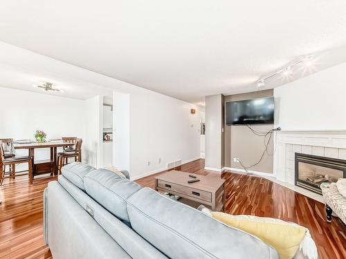 11 2911 36 Street, Edmonton, AB - Indoor Photo Showing Living Room With Fireplace