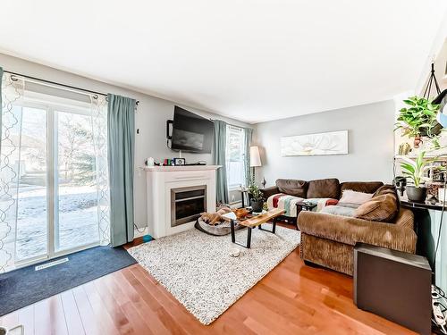 96 230 Edwards Drive, Edmonton, AB - Indoor Photo Showing Living Room With Fireplace