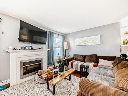 96 230 Edwards Drive, Edmonton, AB - Indoor Photo Showing Living Room With Fireplace