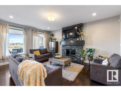 535 Albany Way, Edmonton, AB - Indoor Photo Showing Living Room With Fireplace