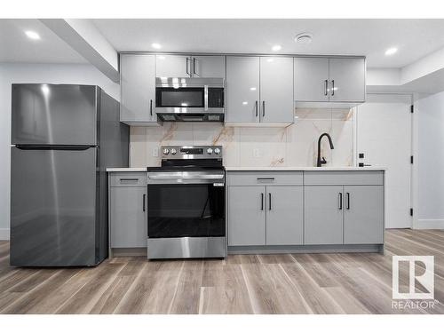 8307 14 Avenue, Edmonton, AB - Indoor Photo Showing Kitchen With Stainless Steel Kitchen