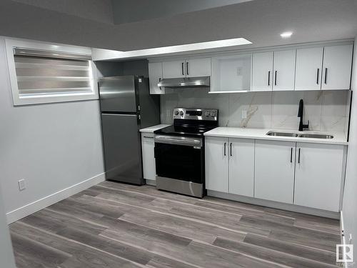 8307 14 Avenue, Edmonton, AB - Indoor Photo Showing Kitchen With Stainless Steel Kitchen With Double Sink