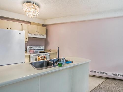 104 11618 100 Avenue, Edmonton, AB - Indoor Photo Showing Kitchen With Double Sink