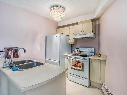 104 11618 100 Avenue, Edmonton, AB - Indoor Photo Showing Kitchen With Double Sink