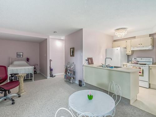 104 11618 100 Avenue, Edmonton, AB - Indoor Photo Showing Kitchen With Double Sink