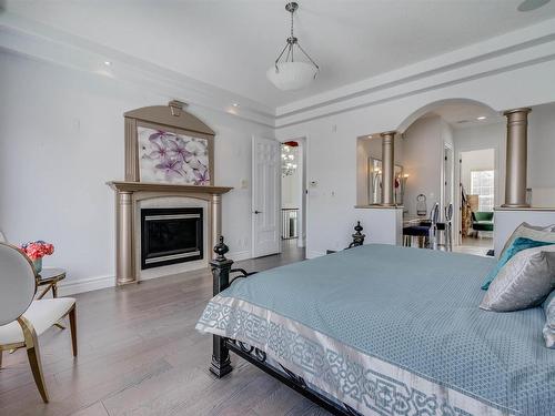 251 Galland Close, Edmonton, AB - Indoor Photo Showing Bedroom With Fireplace