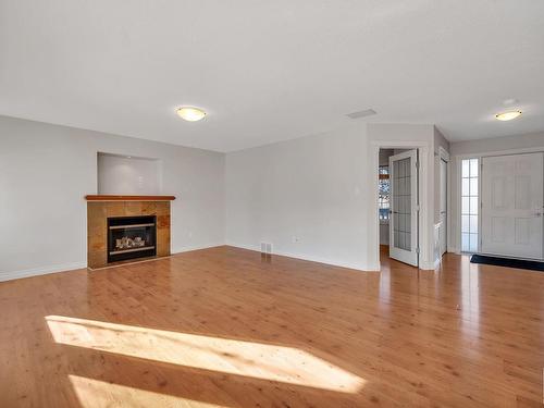 5478 Thibault Wynd, Edmonton, AB - Indoor Photo Showing Living Room With Fireplace