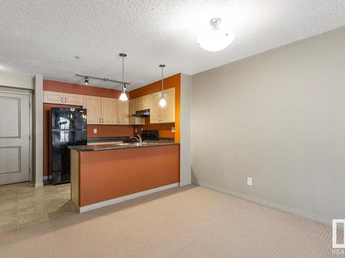 305 11449 Ellerslie Road, Edmonton, AB - Indoor Photo Showing Kitchen With Double Sink