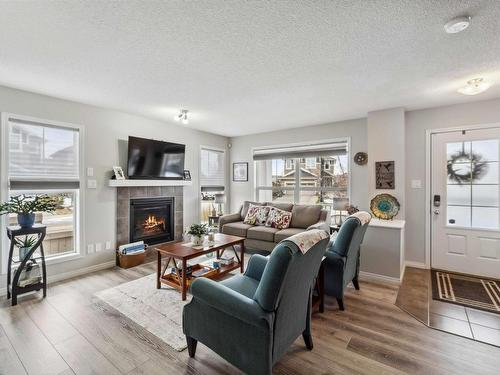 4750 Crabapple Run, Edmonton, AB - Indoor Photo Showing Living Room With Fireplace