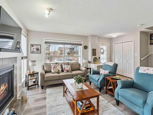 4750 Crabapple Run, Edmonton, AB - Indoor Photo Showing Living Room With Fireplace