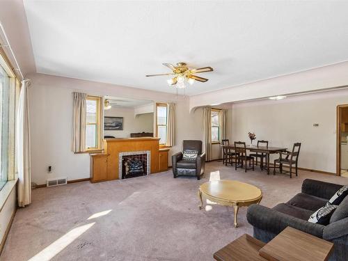 11315 110A Avenue, Edmonton, AB - Indoor Photo Showing Living Room With Fireplace