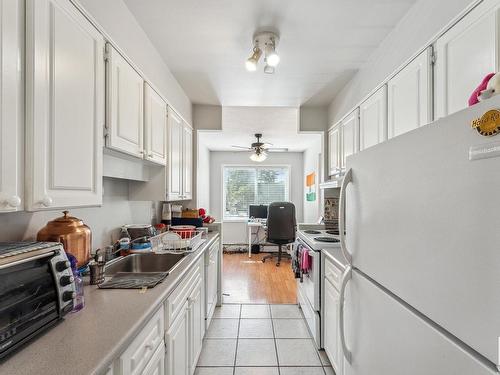 204 11425 41 Avenue, Edmonton, AB - Indoor Photo Showing Kitchen With Double Sink