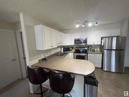 210 13625 34 Street, Edmonton, AB - Indoor Photo Showing Kitchen