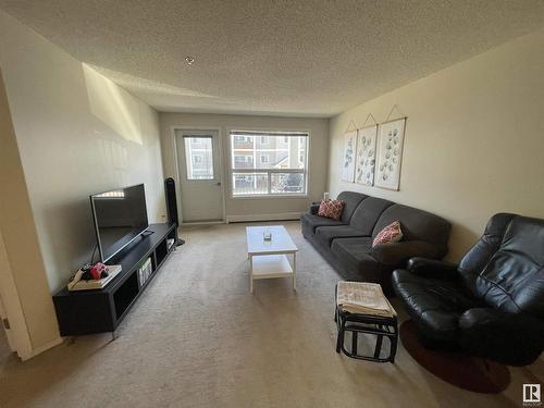 210 13625 34 Street, Edmonton, AB - Indoor Photo Showing Living Room