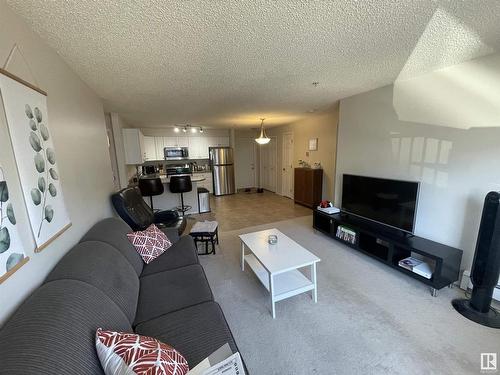 210 13625 34 Street, Edmonton, AB - Indoor Photo Showing Living Room