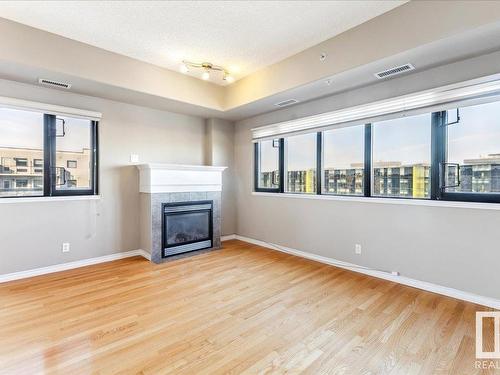 608 10319 111 Street, Edmonton, AB - Indoor Photo Showing Living Room With Fireplace