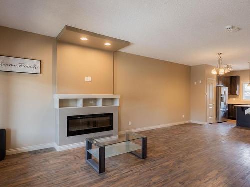 6921 Cardinal Wynd, Edmonton, AB - Indoor Photo Showing Living Room With Fireplace