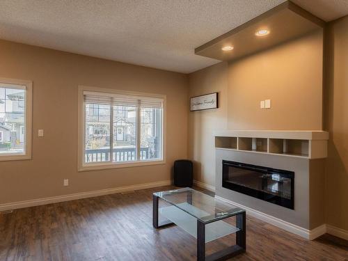 6921 Cardinal Wynd, Edmonton, AB - Indoor Photo Showing Living Room With Fireplace