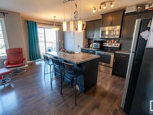 #20 Spruce Boulevard, Leduc, AB - Indoor Photo Showing Kitchen With Stainless Steel Kitchen