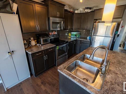 #20 Spruce Boulevard, Leduc, AB - Indoor Photo Showing Kitchen With Stainless Steel Kitchen With Double Sink