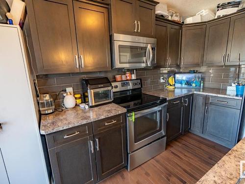 #20 Spruce Boulevard, Leduc, AB - Indoor Photo Showing Kitchen With Stainless Steel Kitchen
