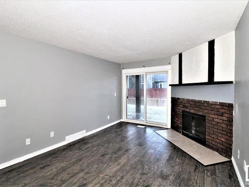 101 12408 161 Avenue, Edmonton, AB - Indoor Photo Showing Other Room With Fireplace