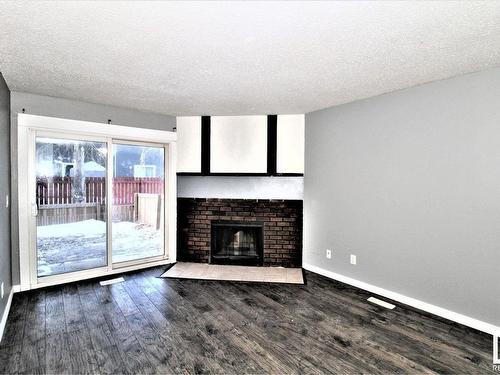 101 12408 161 Avenue, Edmonton, AB - Indoor Photo Showing Living Room With Fireplace