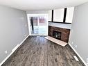 101 12408 161 Avenue, Edmonton, AB  - Indoor Photo Showing Living Room With Fireplace 