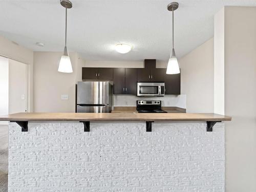 419 1180 Hyndman Road, Edmonton, AB - Indoor Photo Showing Kitchen