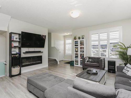 3730 8 Avenue, Edmonton, AB - Indoor Photo Showing Living Room With Fireplace