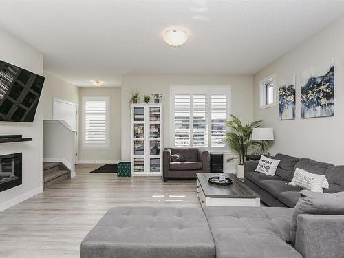 3730 8 Avenue, Edmonton, AB - Indoor Photo Showing Living Room With Fireplace