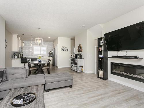 3730 8 Avenue, Edmonton, AB - Indoor Photo Showing Living Room With Fireplace