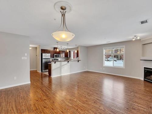 126 7909 71 Street, Edmonton, AB - Indoor Photo Showing Other Room With Fireplace