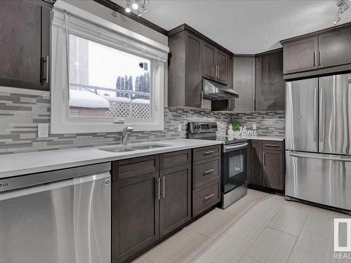 17211 60 Avenue, Edmonton, AB - Indoor Photo Showing Kitchen With Stainless Steel Kitchen With Double Sink With Upgraded Kitchen