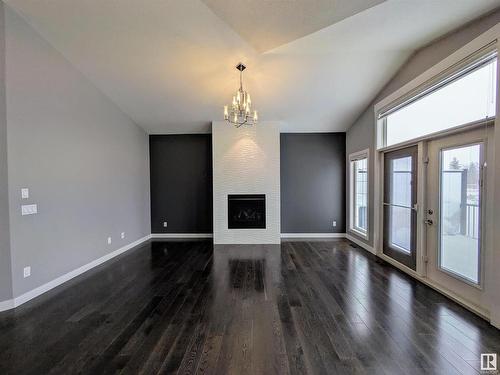 34 3090 Cameron Heights Way, Edmonton, AB - Indoor Photo Showing Other Room With Fireplace