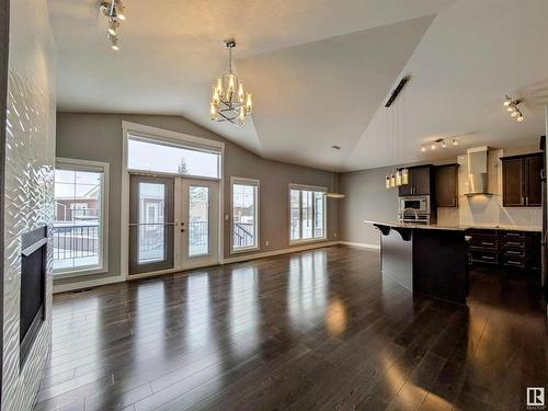 34 3090 Cameron Heights Way, Edmonton, AB - Indoor Photo Showing Other Room With Fireplace