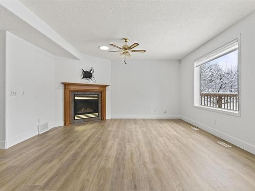 3105 41A Ave, Edmonton, AB - Indoor Photo Showing Living Room With Fireplace