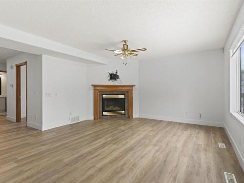 3105 41A Ave, Edmonton, AB - Indoor Photo Showing Living Room With Fireplace