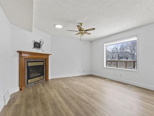 3105 41A Ave, Edmonton, AB - Indoor Photo Showing Other Room With Fireplace