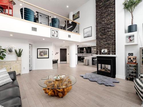 106 9020 Jasper Avenue, Edmonton, AB - Indoor Photo Showing Living Room With Fireplace