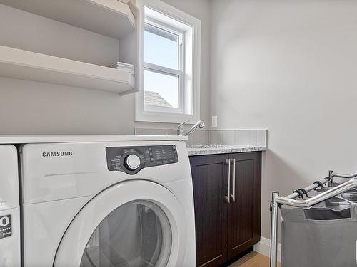 1504 Cunningham Cape, Edmonton, AB - Indoor Photo Showing Laundry Room