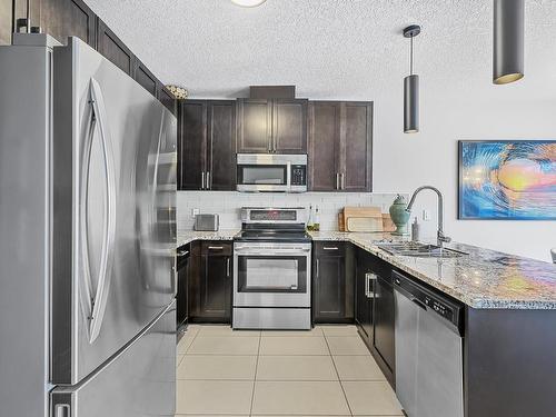 127 5151 Windermere Boulevard, Edmonton, AB - Indoor Photo Showing Kitchen With Stainless Steel Kitchen With Upgraded Kitchen