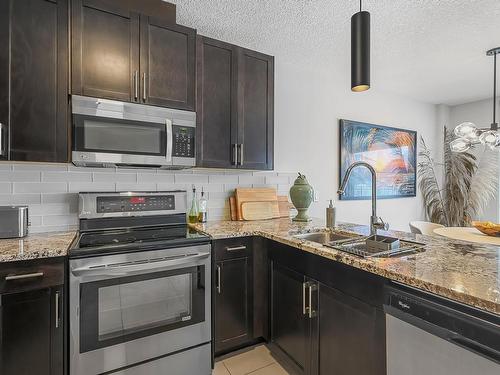 127 5151 Windermere Boulevard, Edmonton, AB - Indoor Photo Showing Kitchen With Double Sink With Upgraded Kitchen